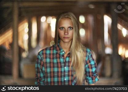 beautiful mysterious young woman in the attic in a wooden house with ghosts