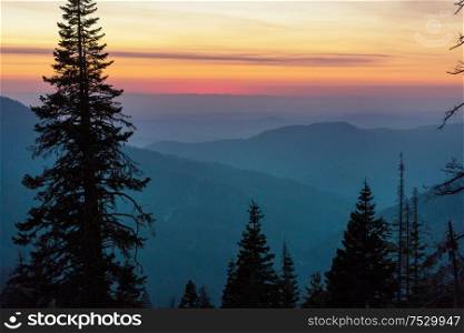 Beautiful natural background. Mountain silhouette at the sunset.