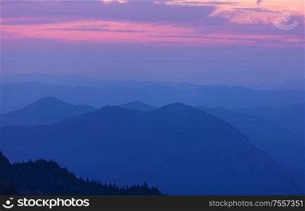 Beautiful natural background. Mountain silhouette at the sunset.
