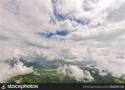 Beautiful natural landscape from high angle view of Mekong River forest and white clouds in the sky on the mountain at Doi Pha Tang view point, Chiang Rai Province, Thailand