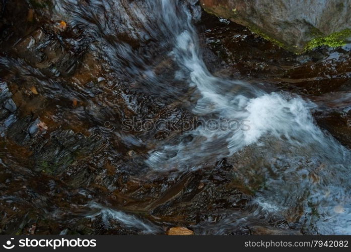 beautiful natural stream among stones.