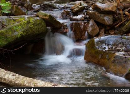 beautiful natural stream among stones.