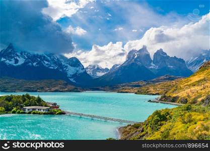 Beautiful natural view of Lake Pehoe and Cuerno del Paine Mountains with rain clouds in the sky at Torres del Paine National Park in, Chile.
