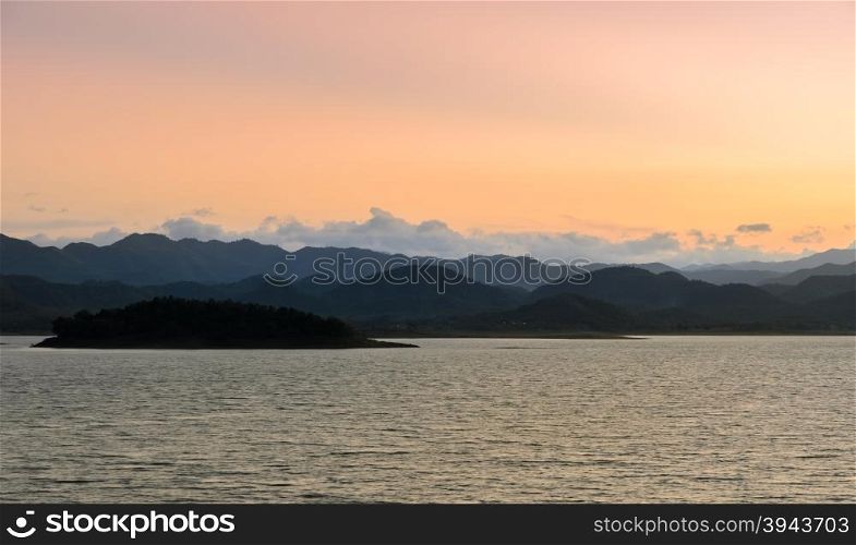 Beautiful nature landscape in sunset light of mountain with lake. Kaeng Krachan Reservoir in Thailand