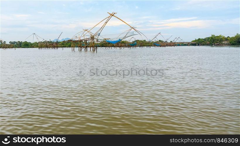 Beautiful nature landscape many Yok Yor is a fishing with local wisdom. Tool for catch fish of native people made of bamboo and net rural lifestyle at Pakpra canal, Baan Pak Pra, Phatthalung, Thailand. Many Yok Yor is a fishing with local wisdom in Thailand