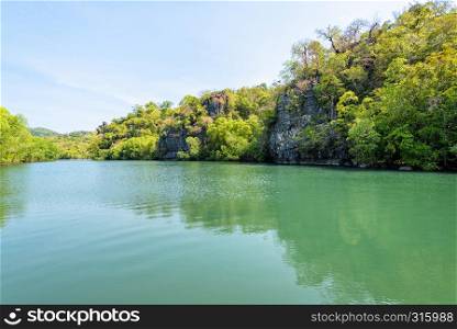 Beautiful nature landscape of green water forest and stone at Phante Melaka Canal. Water travel route to cruise to Crocodile Cave at Tarutao National Park, Satun, Thailand. Phante Melaka Canal at Koh Tarutao, Thailand