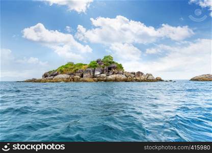 Beautiful nature landscape of Ko Hin Sorn small island with surprisingly overlap rocks in the Andaman Sea and sky in summer attractions near Koh Lipe at Tarutao National Park, Satun, Thailand. Ko Hin Sorn island in Thailand