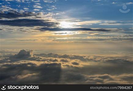 Beautiful nature landscape of rising sun in the early morning over sea of mist