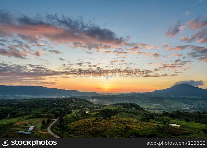 Beautiful nature landscape of the colorful sky and mountains during the sunrise at Khao Takhian Ngo View Point, Khao Kho attractions in Phetchabun, Thailand. Sunrise at Khao Takhian Ngo View Point