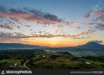 Beautiful nature landscape of the colorful sky and mountains during the sunrise at Khao Takhian Ngo View Point, Khao Kho attractions in Phetchabun, Thailand. Sunrise at Khao Takhian Ngo View Point