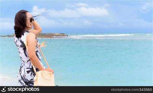 Beautiful nature landscape the beach and sea in summer sky and cheerful woman tourist wearing sunglasse laughing with happy on Tarutao island, Satun, Thailand, 16 9. Woman tourist on the beach in Thailand