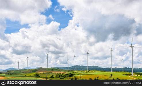 Beautiful nature landscape windmills field on the hill and blue sky, white clouds are the background at Khao Kho, Phetchabun Province, Thailand, 16 9 wide screen. Landscape windmills field