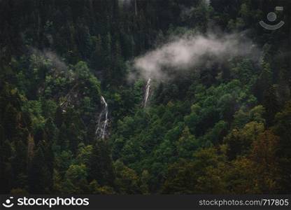 Beautiful nature of Georgia. Foggy mountain forest and Amazing waterfalls, Racha