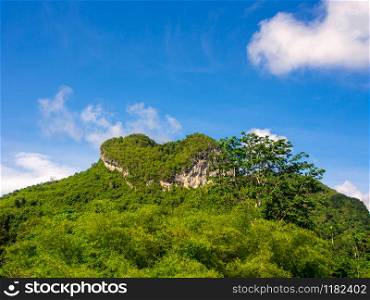 beautiful nature of mountain in the shape of heart with blue sky background. At Surat Thani, Thailand