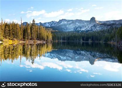 Beautiful nature scene in autumn mountains. Sierra Nevada lake reflection.