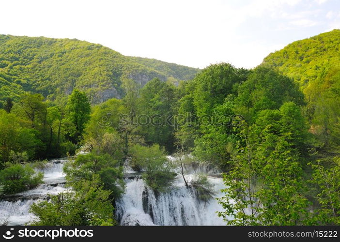 beautiful nature scene with river and waterfall at spring seasson