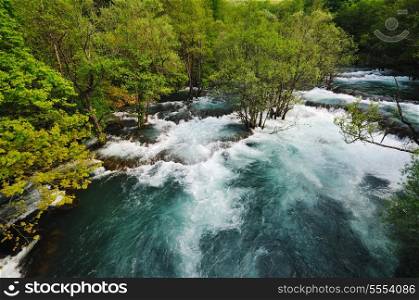 beautiful nature scene with river and waterfall at spring seasson