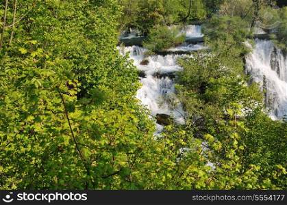 beautiful nature scene with river and waterfall at spring seasson