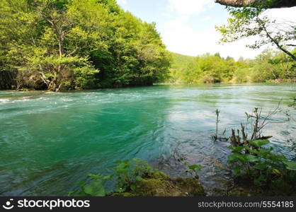 beautiful nature scene with river and waterfall at spring seasson