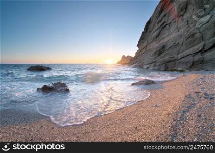 Beautiful nature seascape. Seashore and stone on the beach.