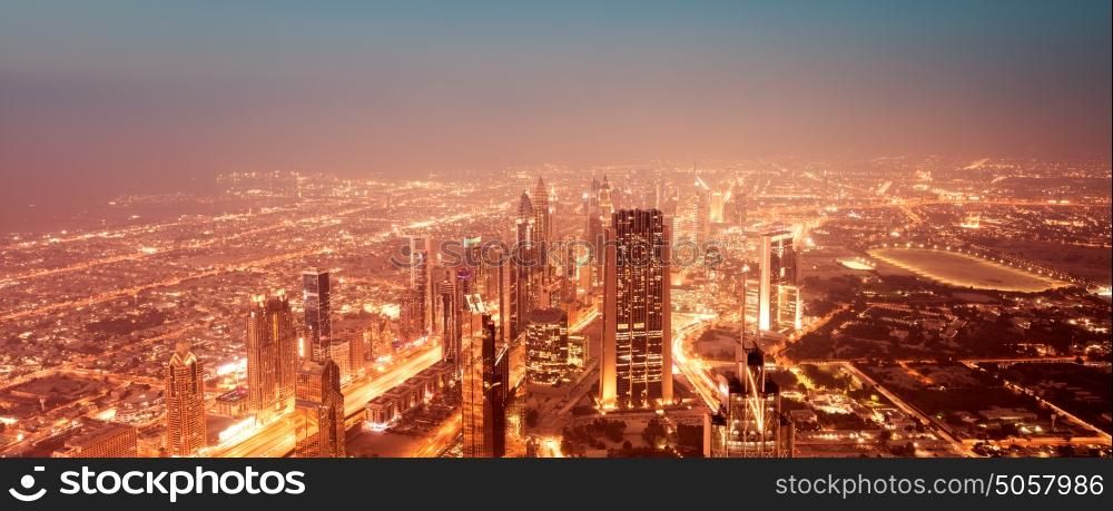 Beautiful night Dubai cityscape, panoramic view on amazing glowing at night luxury city, expensive life, center of business and travel, UAE