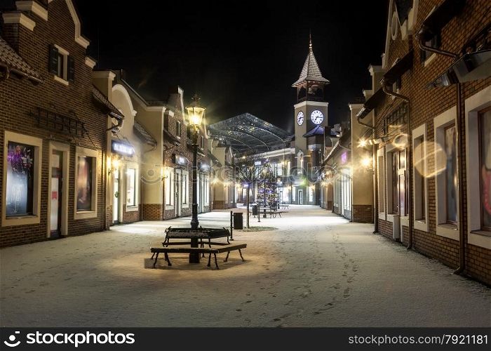 Beautiful night landscape of winter street with tower clock