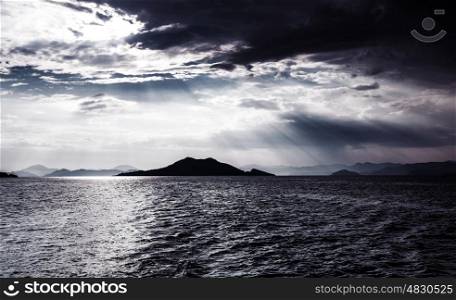 Beautiful night seascape, abstract natural background, dramatic cloudscape, island in moonlight, mysterious water landscape, magic night