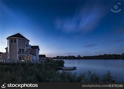 Beautiful night sky astrophotography landscape image of stars over still lake