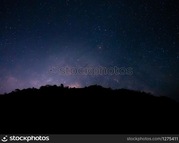 beautiful night sky from milky way galaxy with stars and meteor over mountain at national park, Thailand on February 2020