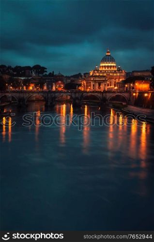 Beautiful night view on St. Peter&rsquo;s Basilica, glowing lights of the church reflected in the river, amazing European architecture of Italy, Rome, Vatican