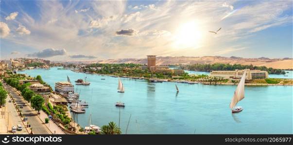 Beautiful Nile panorama and Aswan city with sailboats, Egypt.. Beautiful Nile panorama and Aswan city with sailboats, Egypt