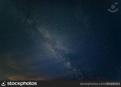 Beautiful noctilucent cloud formations against Milky Way background night sky