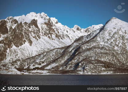 beautiful Norwegian landscape at the Lofoten Islands. Norway. beautiful snowy mountains and their reflection in the fjord