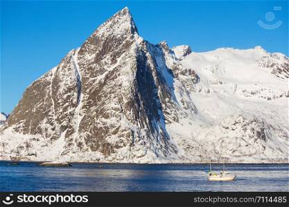 beautiful Norwegian landscape in winter. fishing boat. Lofoten Islands. Norway.