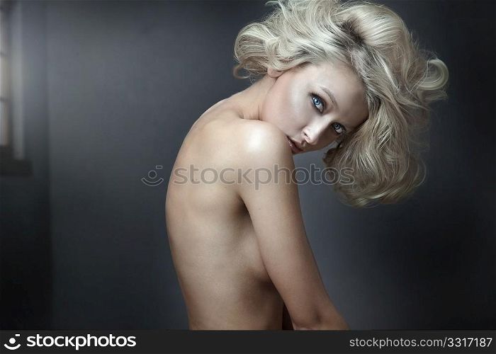 Beautiful nude blonde beauty posing
