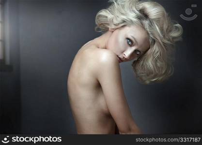 Beautiful nude blonde beauty posing