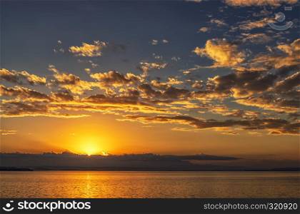 Beautiful ocean landscape with vibrant sunset or sunrise
