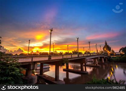 Beautiful of sunset at the Bridge over the Nan River in Phitsanulok City, Thailand.