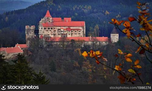 Beautiful old castle in forests with autumn landscape. Castle Pernstejn - Nedvedice. Europe Czech Republic.