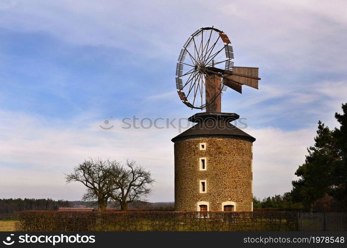 Beautiful old windmill at sunset with sky and clouds. Ruprechtov - Czech Republic - Europe.