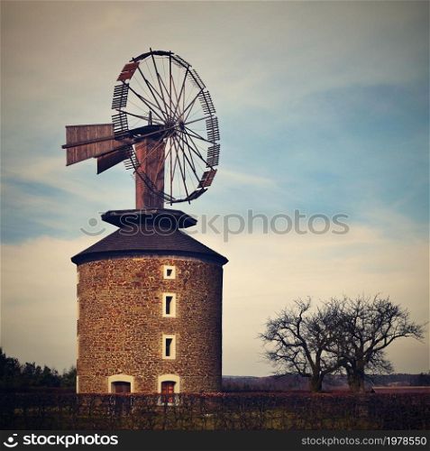 Beautiful old windmill at sunset with sky and clouds. Ruprechtov - Czech Republic - Europe.
