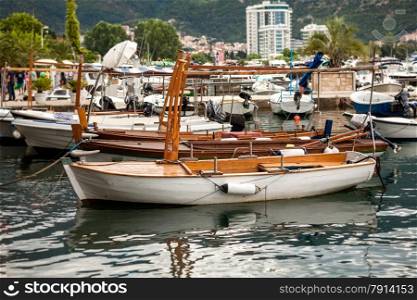 Beautiful old wooden boat used for touristic trips moored at sea harbor