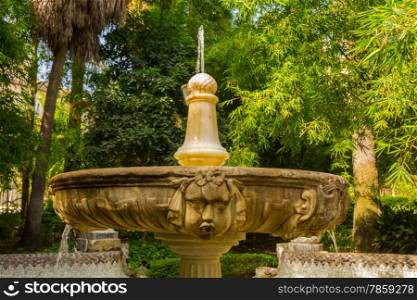 beautiful ornamental fountain highly decorated in the Park of Malaga, Spain