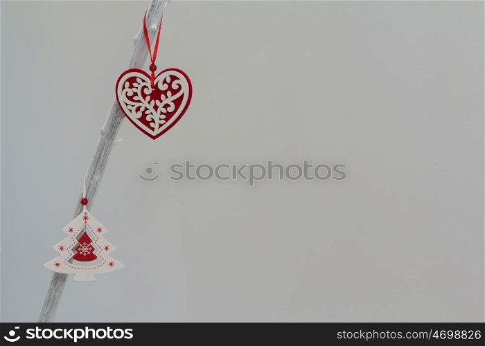 Beautiful ornates for Christmas hanging a white branch of a tree