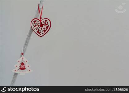 Beautiful ornates for Christmas hanging a white branch of a tree