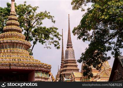Beautiful pagodas decorated with ceramic tiles at Wat Pho or Wat Phra Chetuphon in Bangkok old town near Grand palace
