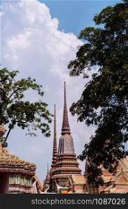 Beautiful pagodas decorated with ceramic tiles at Wat Pho or Wat Phra Chetuphon in Bangkok old town near Grand palace