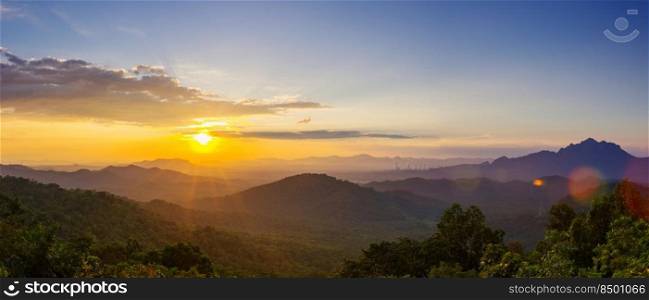 Beautiful  panorama landscape sunset over peak Mountain with warm light Mae Moh  L&ang, Thailand..  sunset over peak Mountain.