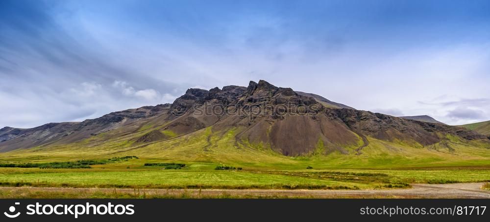 Beautiful panorama mountain range landscape with blue sky, Iceland, selective focus