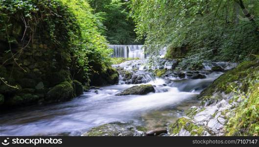Beautiful panorama view of water fall landscape at green forest in the summer, Ghyll Force, Ambleside, Lake District National Park, UK